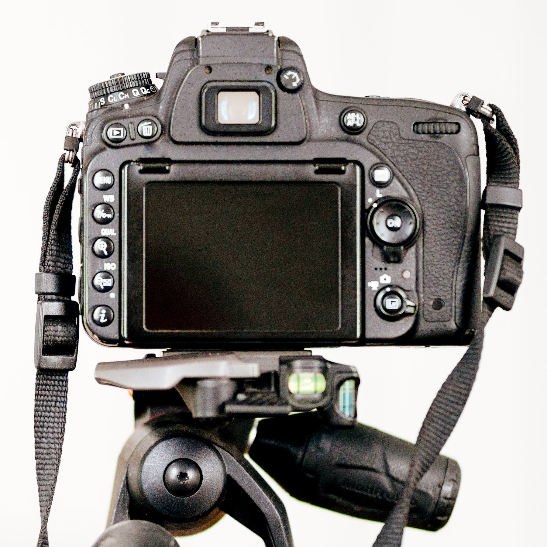 Professional dslr camera standing on tripod and taking interior design photos